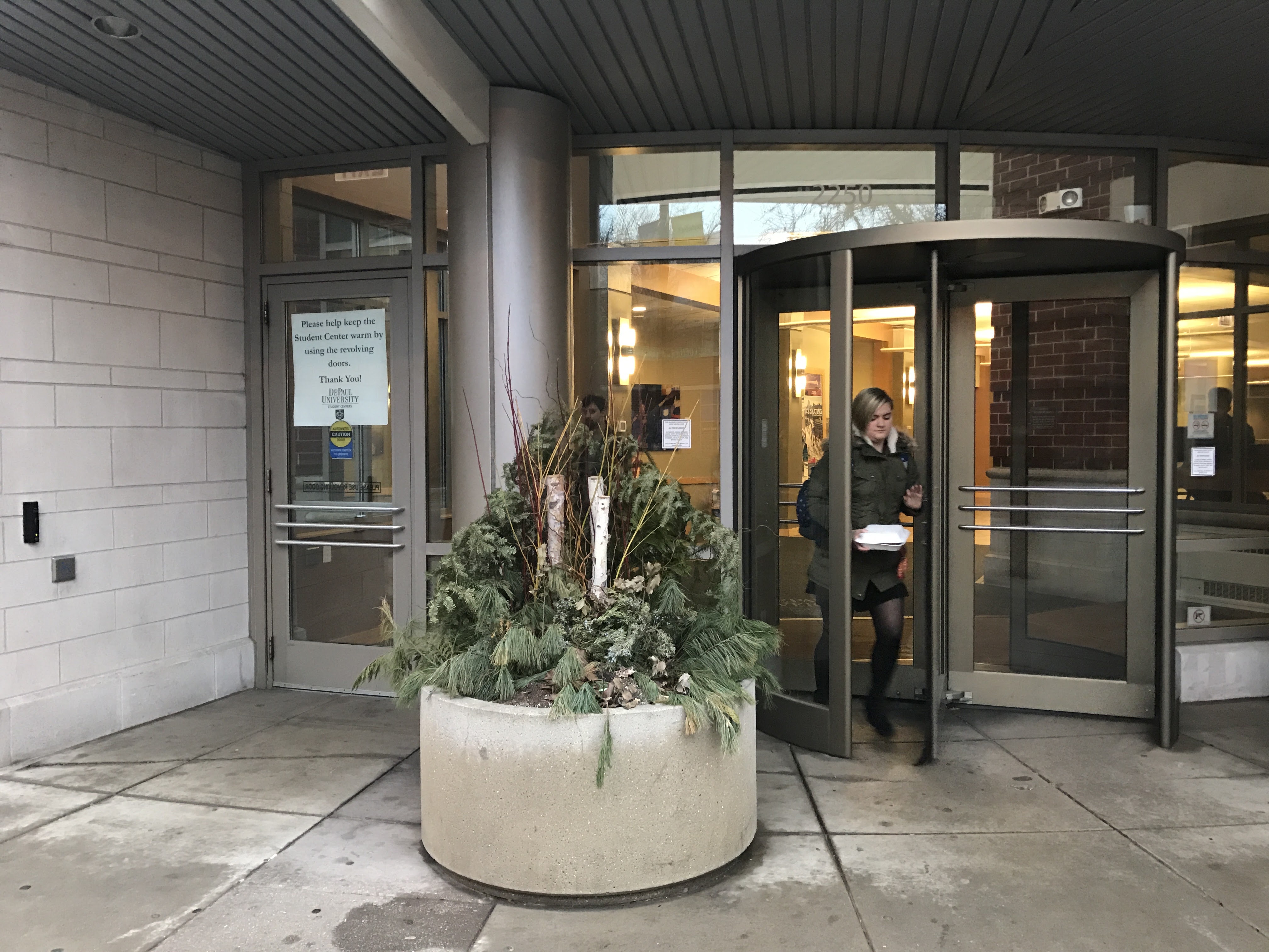 Entrance to the student center with accessible entrance to the left of a revolving door.