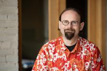 Headshot of Oz in a D&D Hawaiian shirt.