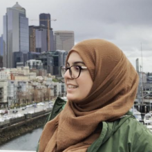 Fatima side profile shot with Seattle backdrop.