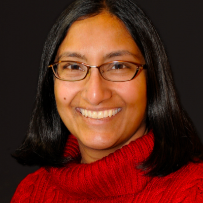 Sadia's headshot. She is in a red sweater.