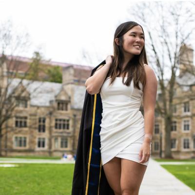 Anna Vento holding graduation gown